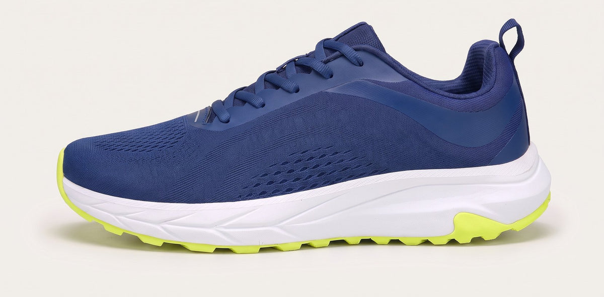 Bolster sneaker in navy with a volt sole, side view