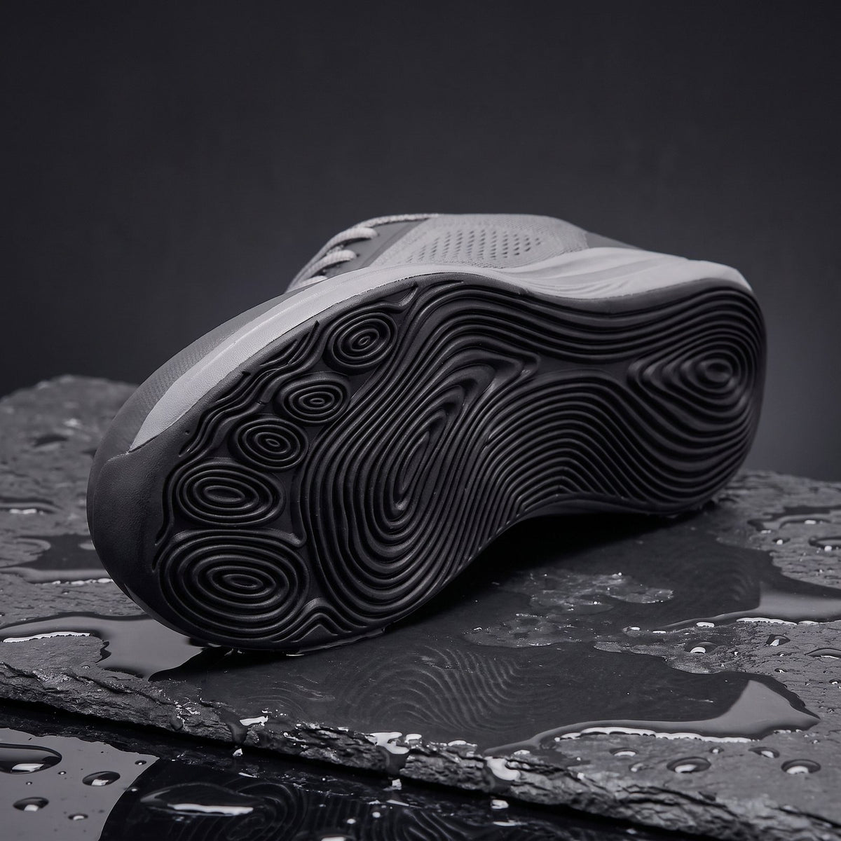 Holt's rippled outsole on wet slate