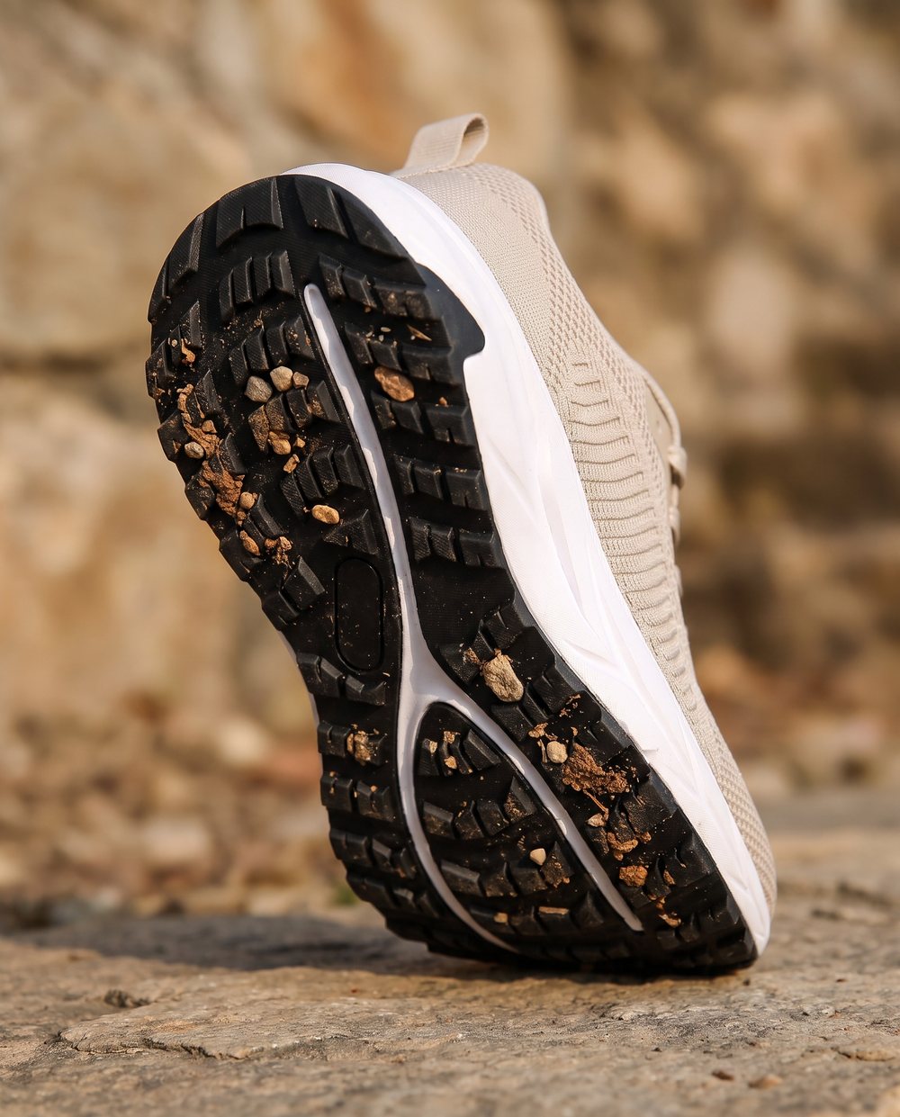 Tallgrass's deep rubber lugs with gravel in the tread